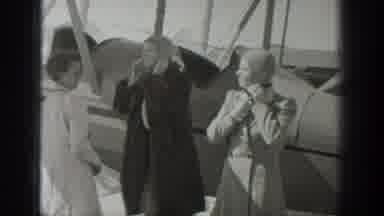 Wyoming USA (1939): Multiple People Ride And Start The Propeller Of A Plane