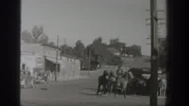 Wyoming USA (1939): Man On Horseback Leads Two More Horses Happily Behind Him