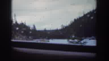Wyoming USA (1939): A Snowy Scene And Grassy Scene Is Seen Out The Window
