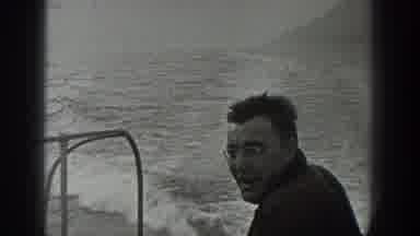 Washington USA (1940): Man Riding A Motorboat Around An Island Where His House Is