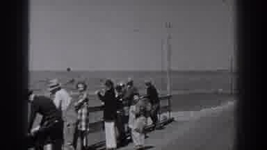 Washington USA (1940): People Are On A Bridge Fishing And A Boy Is Showing A Man