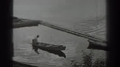 Washington USA (1940): Person Sits Alone In Canoe In Calm Body Of Water