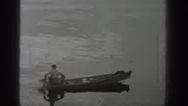 Washington USA (1940): Black And White Footage Of Man Sailing Across A Lake On A