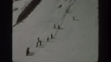 Washington USA (1940): A Person Having Fun Snowboarding Down A Hill