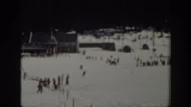 Washington USA (1940): People Skiing Down A Snowy Mountain Outside, While Others