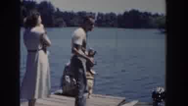 Wisconsin USA-1953: Family Enjoying Boating And Fishing On Lake