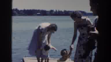 Wisconsin USA (1953): Families On Dock At Lake Walking Children