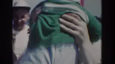 Wisconsin USA (1953): A Mother Carrying Her Children In Her Arms While The Father