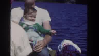 Wisconsin USA (1953): People Riding On A Boat, Man Holding A Baby