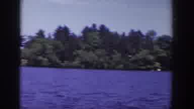 Wisconsin USA (1953): A Man With His Baby Riding In The Ship At The Sea