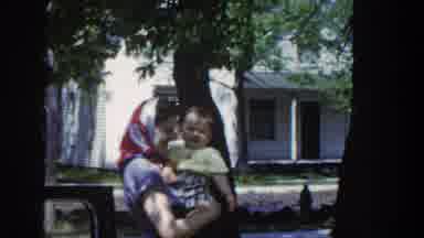 Wisconsin USA (1953): Parents Spend Time With Their Young Kids Outside On A