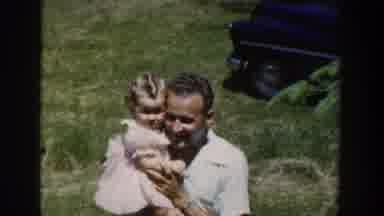 Wisconsin USA (1953): Old Footage Father Or Grandfather Carrying Baby Up To Camera