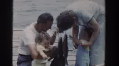Wisconsin USA (1953): Family Fishing In A Lake With A Big Fish In Hand