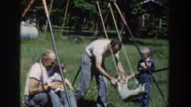Wisconsin USA (1953): Grandfathers Having Fun With Grandchildren On Swings