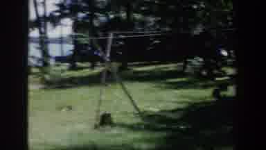 Wisconsin USA (1953): A Boy And Girl Toddler Play In A Small Swimming Pool On A