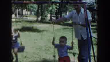 Wisconsin USA (1953): Two Child Was In Swing In The Garden Push In The Parent