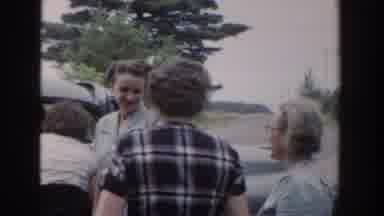 Wisconsin USA (1953): Women Coming Out To Meet Someone Who Just Came Up In A Car