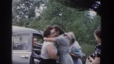Wisconsin USA (1953): People Greeting Each Other In Front Of A Car