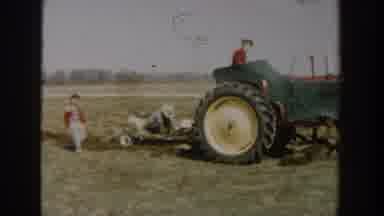 Wisconsin Dells Wisconsin USA (1954): Tractor Pulling Children Across The Field On