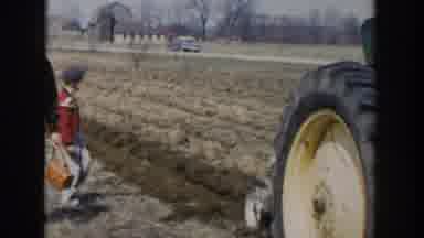 Wisconsin Dells Wisconsin USA (1954): People Following A Tractor As It Works In A