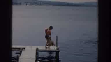 Wisconsin Dells Wisconsin USA (1954): Child Wearing Life Jacket Jumps Off Dock,