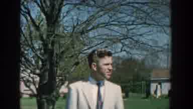 Michigan USA (1957): Several People Outside Wearing Suits And Hats Near Barns And
