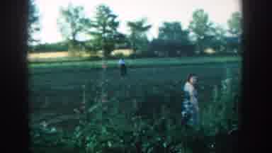 Michigan USA (1957): A Woman Inviting Someone Over To Take A Look At A Field Her