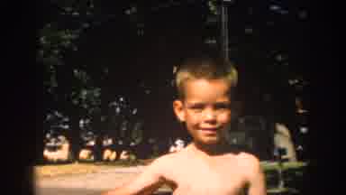 Michigan USA (1957): Young Boy Smiling During The Summer And On A Wagon
