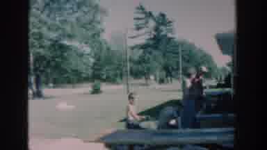 Michigan USA (1957): Family Consisting Of Man, Woman, And Two Children On Wagon