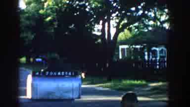 Wisconsin USA (1957): Kid Playing On The Street In His Neighborhood And A Weird