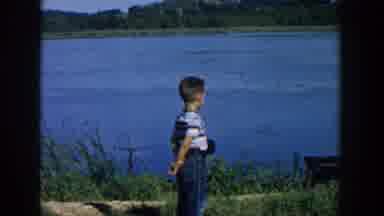 Wisconsin USA (1957): A Young Boy And His Parent Enjoy The Outdoors By The Lake