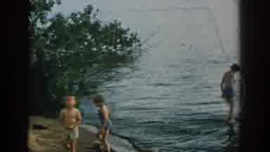 Wisconsin USA (1957): One Man And Three Kids Are In The Seashore Side