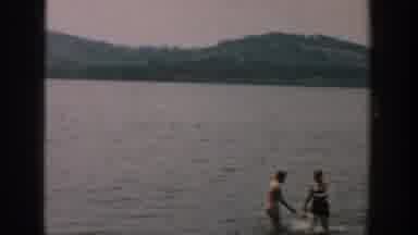 Wisconsin USA (1957): A Family Playing In The Water And On The Beach On A