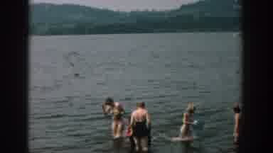 Wisconsin USA (1957): Group Of People Bathing In Calm Water On A Beautiful Sunny