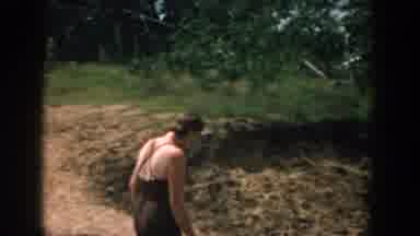 Wisconsin USA (1957): Waman And Man Walking Dog Woman In Hay Field Family Enjoys