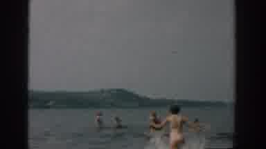 Wisconsin USA (1957): Smoking Women Sitting Cross Legged Field Child Running Water