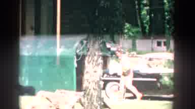 Wisconsin USA (1957): Woman Look And Find A Front Door Walking From Around A House