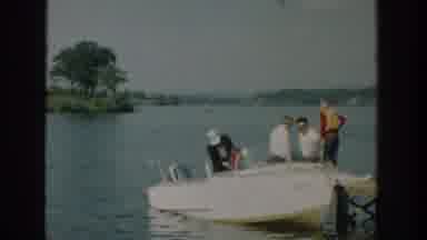 Wisconsin USA (1957): People Outdoors Getting Onto A Docked Boat As A Man Waves At