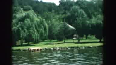 Wisconsin USA (1957): Panoramic Footage Of A Lake With Green Grass And Trees