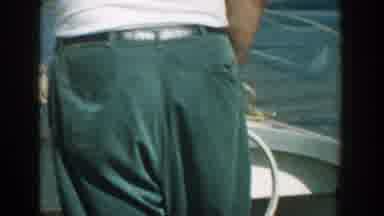 Wisconsin USA (1957): A Old Man And A Old Lady Driving Motor Boat At Lake