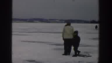 Wisconsin USA (1957): Grandma Watches The Children Play On The Frozen Lake While