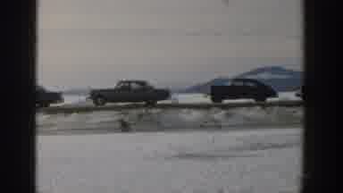 Wisconsin USA (1957): Old Cars Parked In An Empty Place With People Suffering