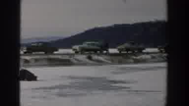 Wisconsin USA (1957): People Sit On Icy Ground While Car Drives By In The