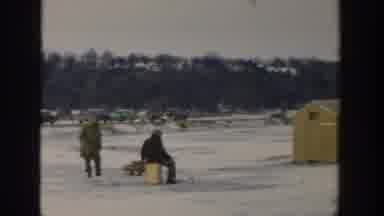 Wisconsin USA (1957): Car Driving Away From Ice Fishing Camp Into Snowy Hills