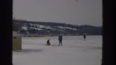 Wisconsin USA (1957): People Ice Fish Near A Shed On A Frozen Lake Surrounded By