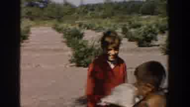 Michigan USA (1958): A Blonde Girl Takes The Hat Off A Boy And Plays With Another