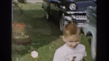 Michigan USA (1958): The Child Enjoying In The Garden, Also Child Is Happy