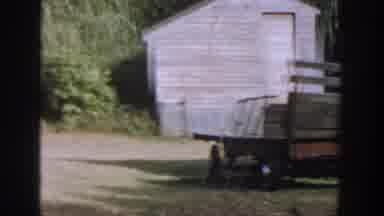 Michigan USA (1958): A Cart Is Sitting Next To A Building And Other White Houses