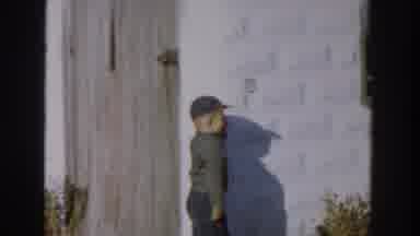 Michigan USA (1958): Boy Running Around Outside, Goes Into Wooden Fence Chasing A