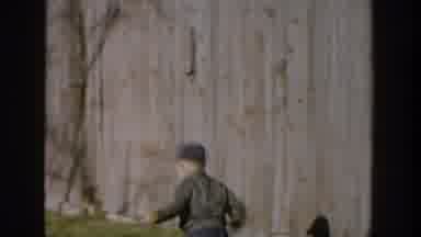 Michigan USA (1958): Little Boy Chasing Girl And Then Little Girl Petting Animal